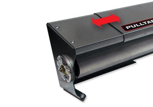 Close-up of a metal roller door operator with mounting bracket; red arrow highlights the top access panel.